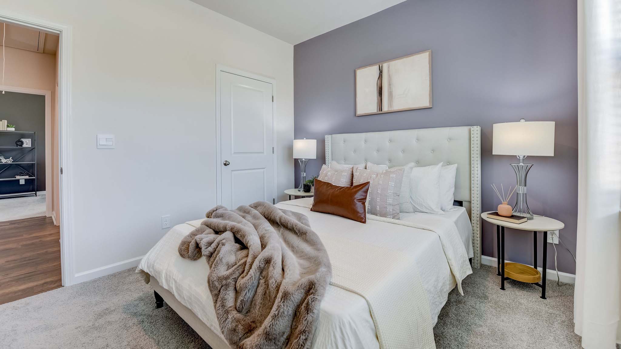 Carpeted bedroom with large window