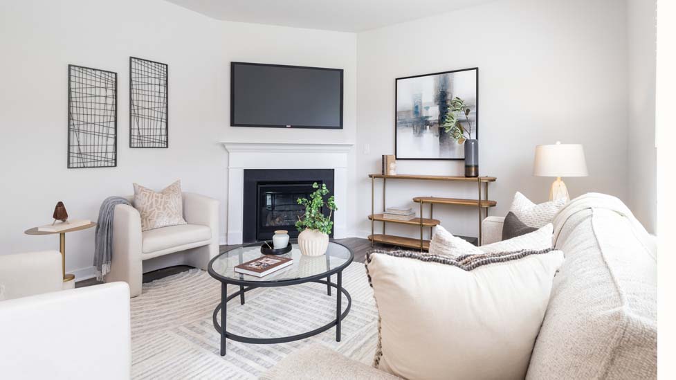 living room with vinyl flooring, electric fireplace and large window