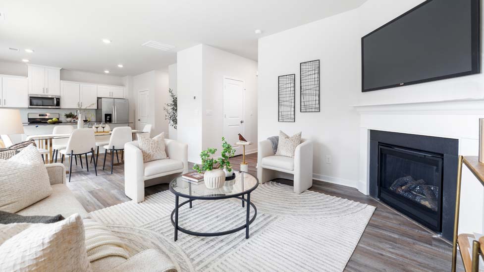 living room with vinyl flooring, electric fireplace and large window