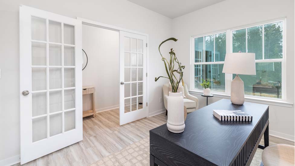 Office space with french doors and vinyl floors