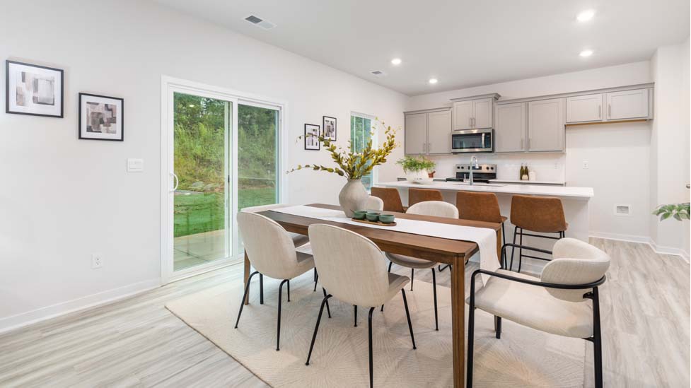Dining room beside kitchen with sliding glass back door