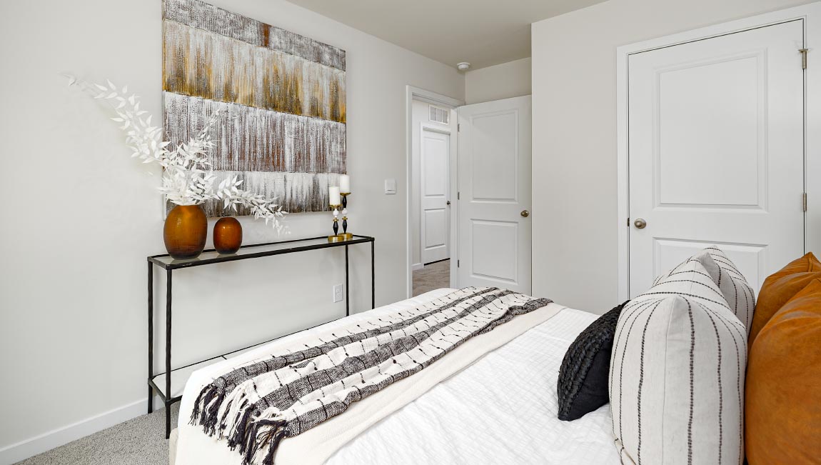 Carpeted bedroom with large window