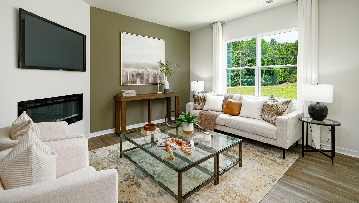 living room with vinyl flooring, electric fireplace and large window