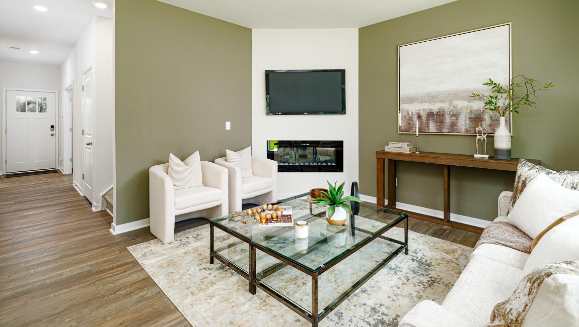 living room with vinyl flooring, electric fireplace and large window