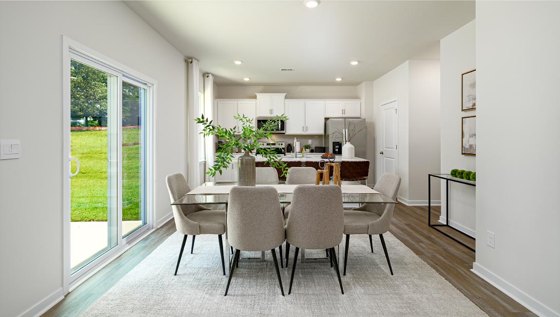 Dining room beside kitchen with sliding glass back door