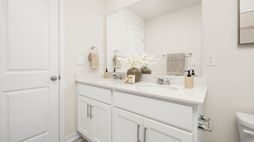 Bathroom with white cabinets
