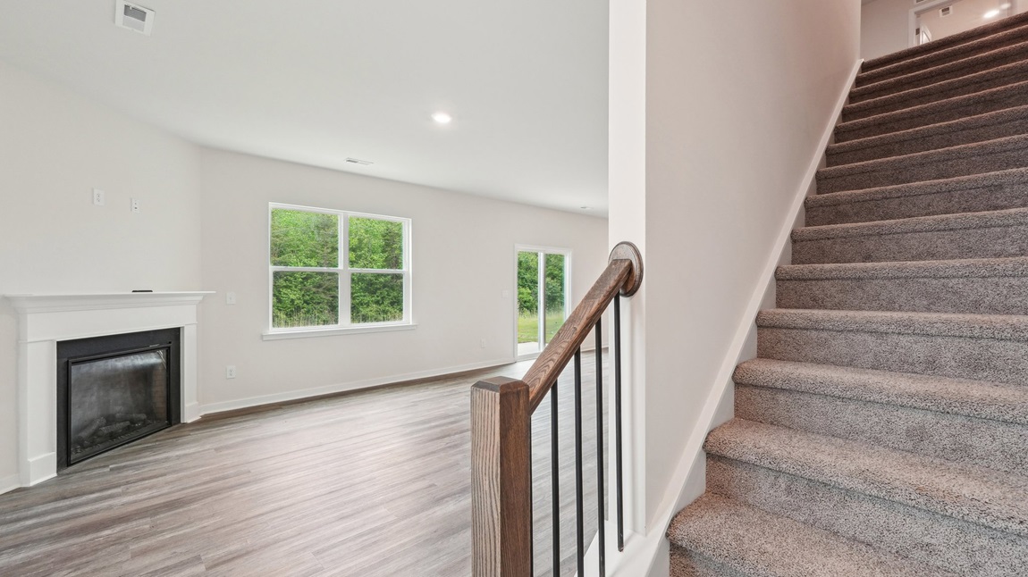 kitchen and island with large window and stainless steel appliances