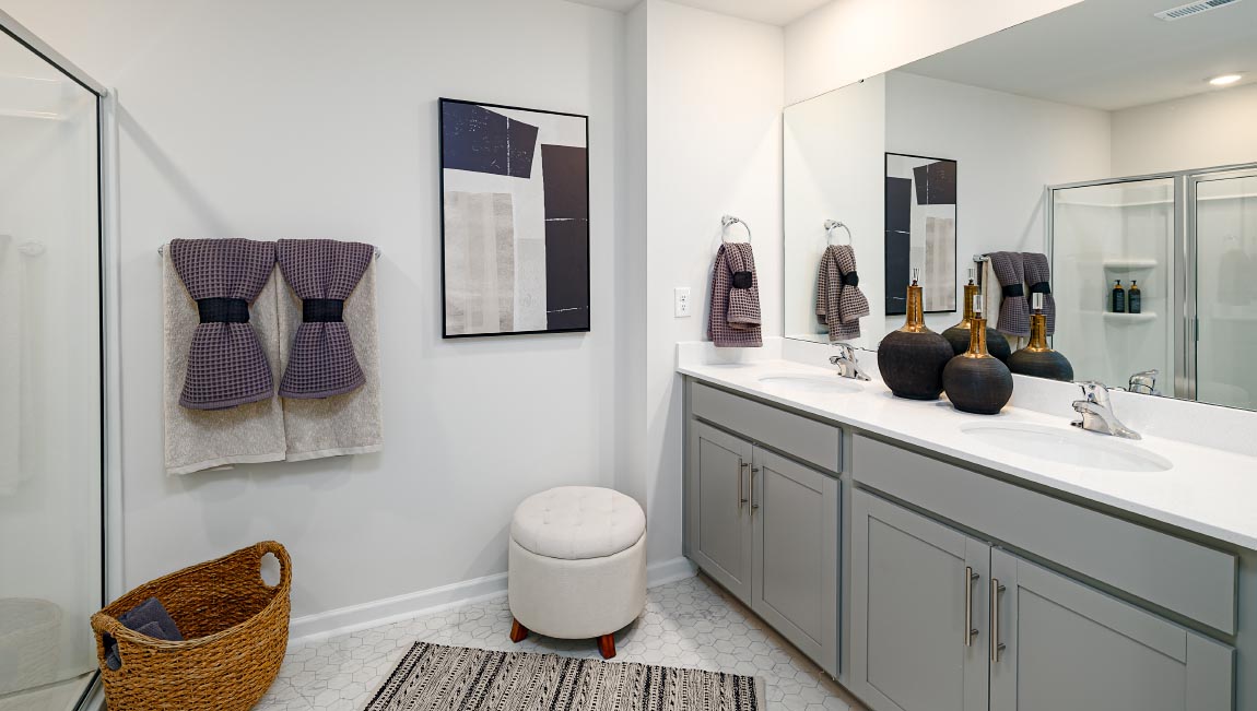 Primary bathroom with glass door shower, and bathtub