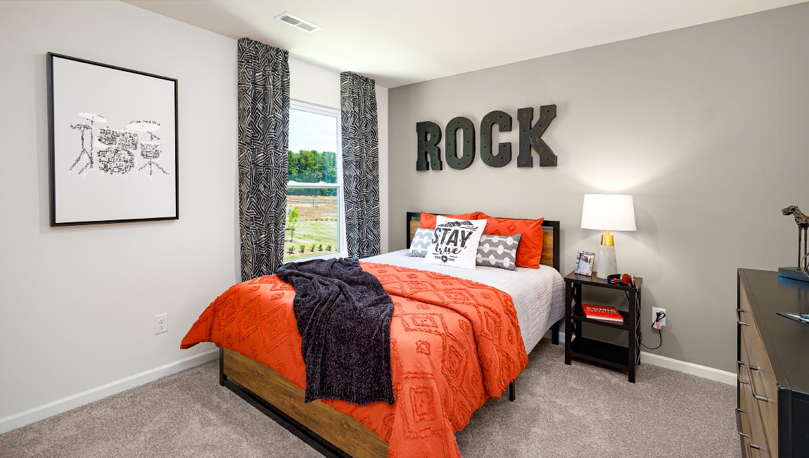 Carpeted bedroom with large window