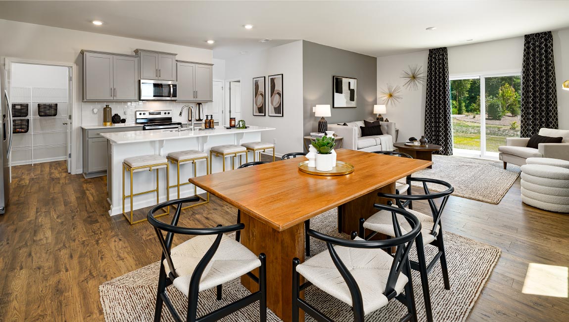 Dining Room in view of family room, wood floors, two windows alongside