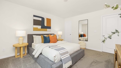 carpeted bedroom with small window