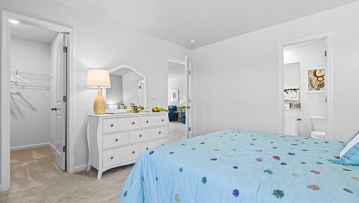 Carpeted bedroom with large window