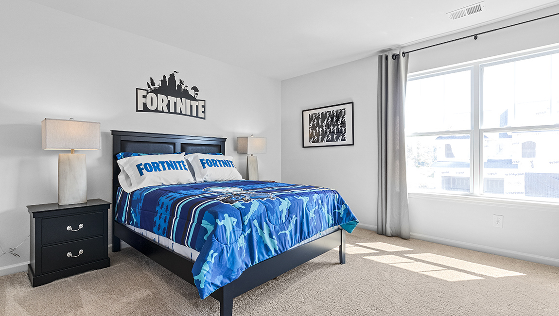 Carpeted bedroom with large window