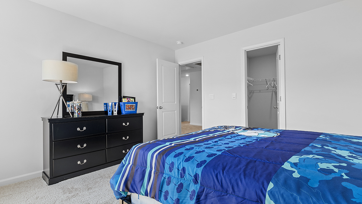 Carpeted bedroom with large window