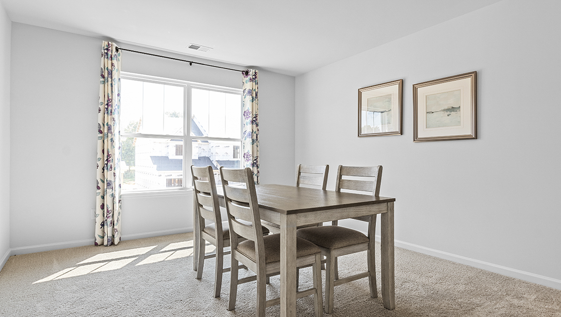 Carpeted bedroom with large window