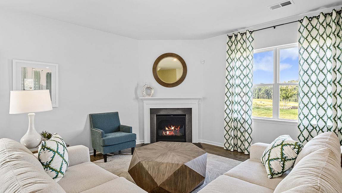Open family room with windows and fireplace