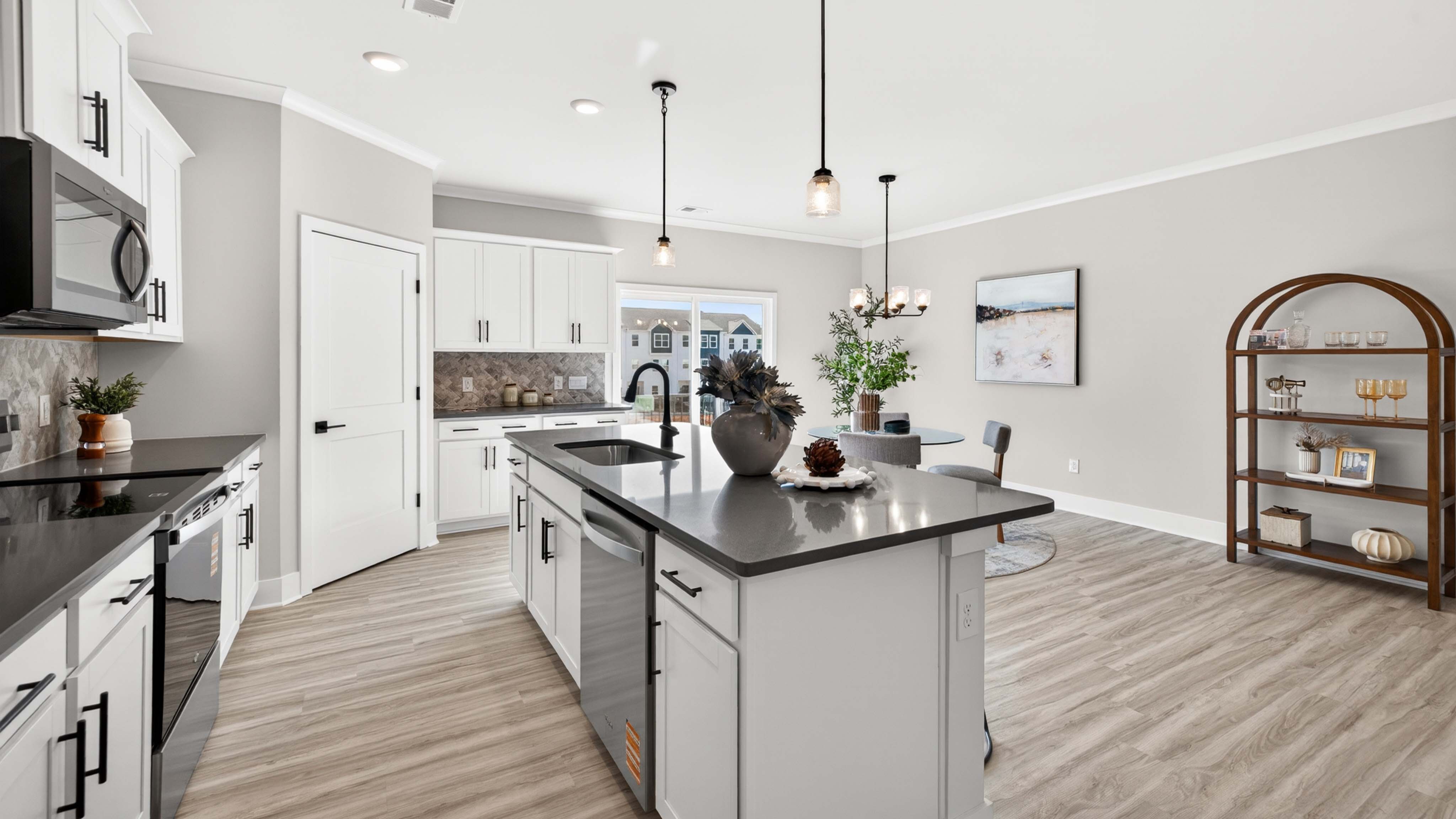 Kitchen and island with stainless steel appliances