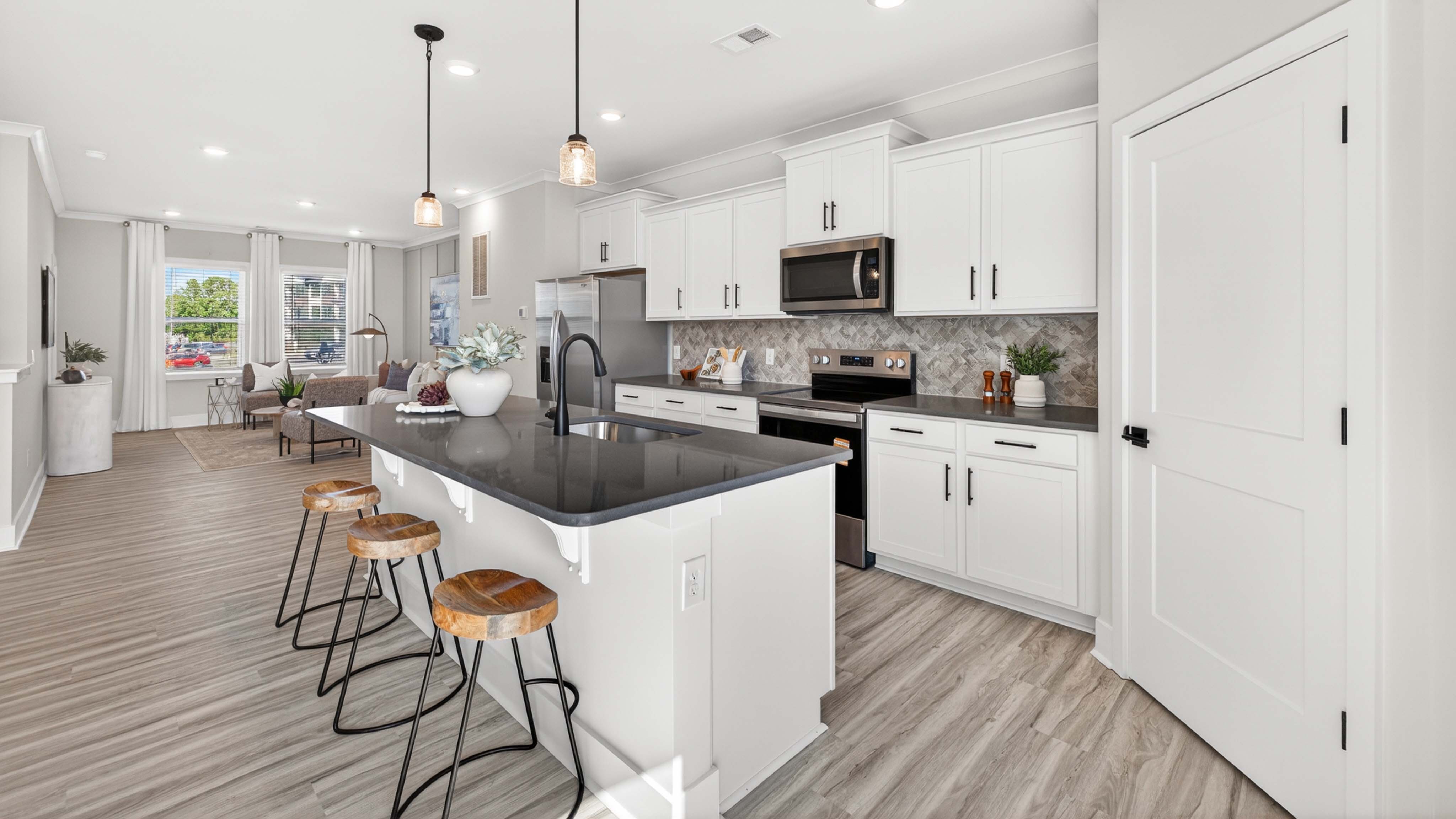 Kitchen and island with stainless steel appliances