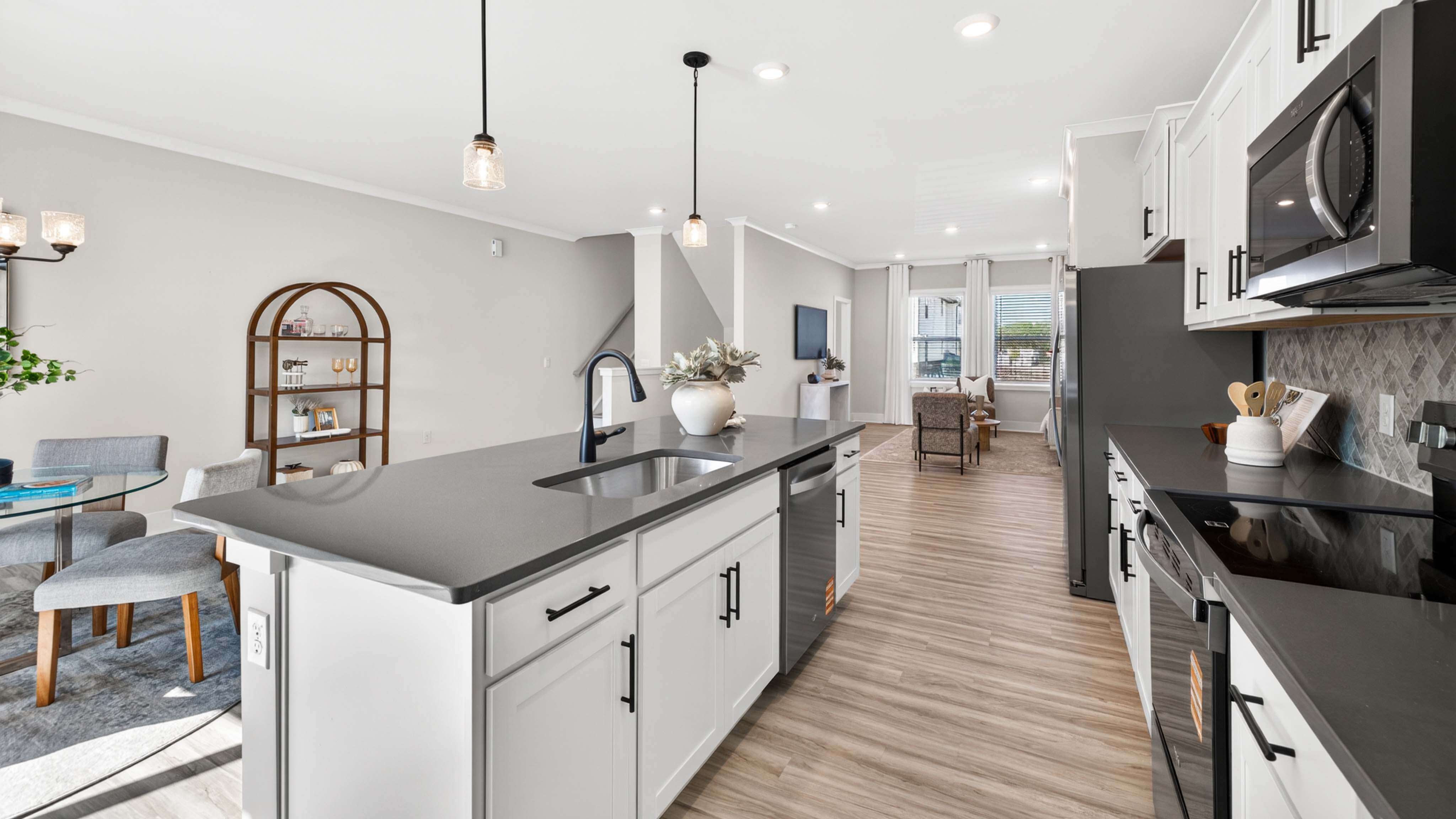Kitchen and island with stainless steel appliances