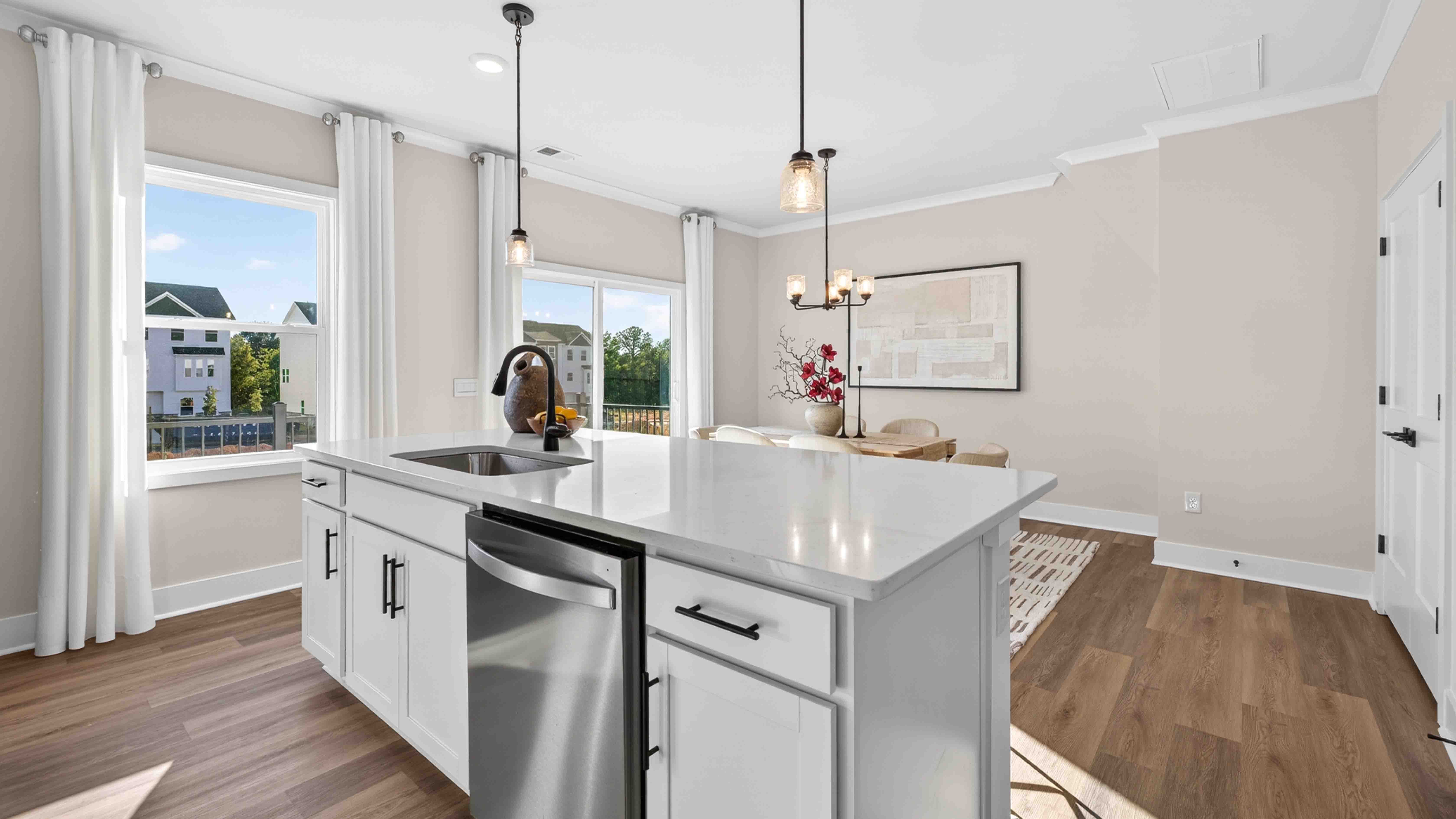 Kitchen and island with stainless steel appliances