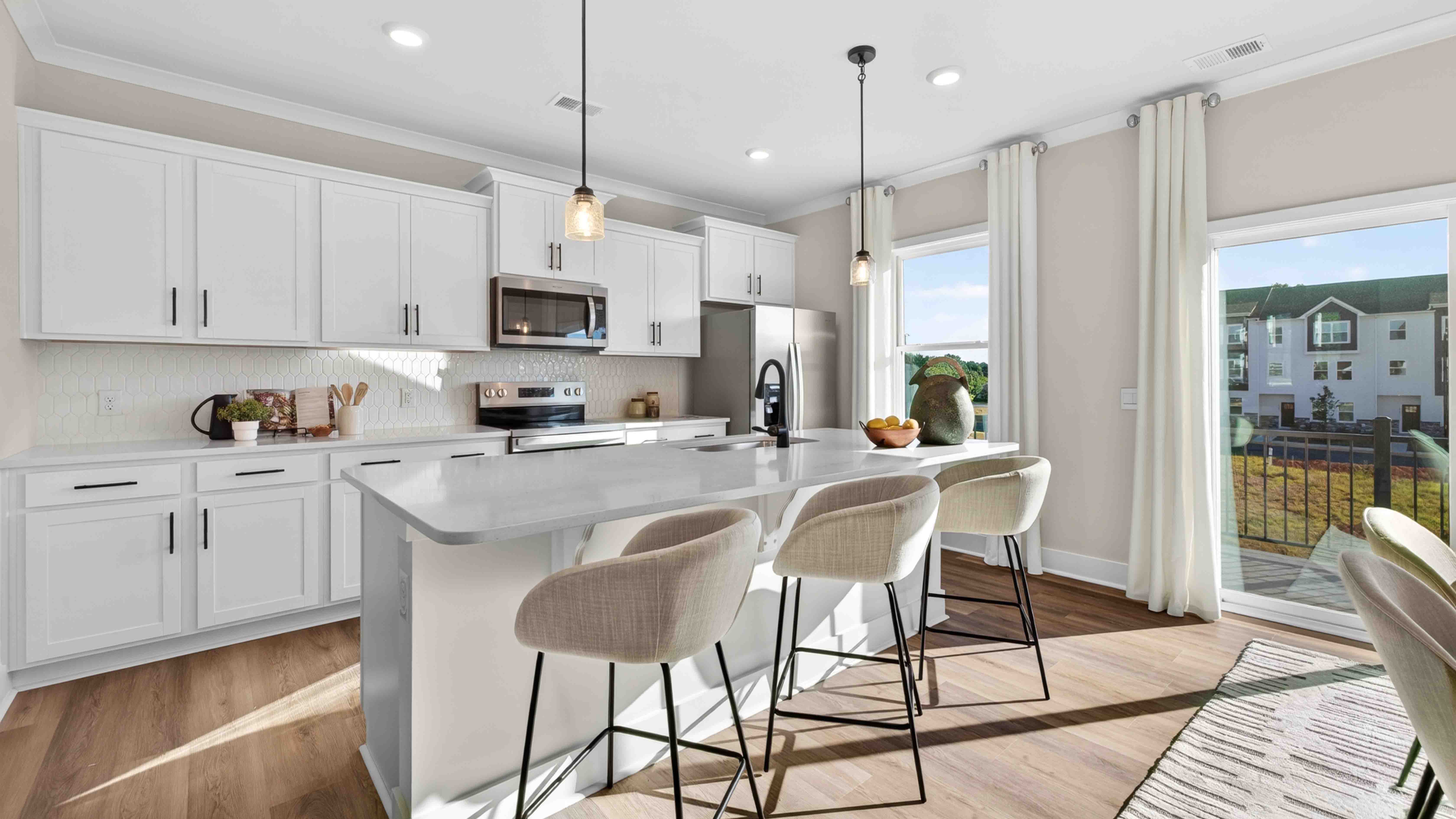 Kitchen and island with stainless steel appliances