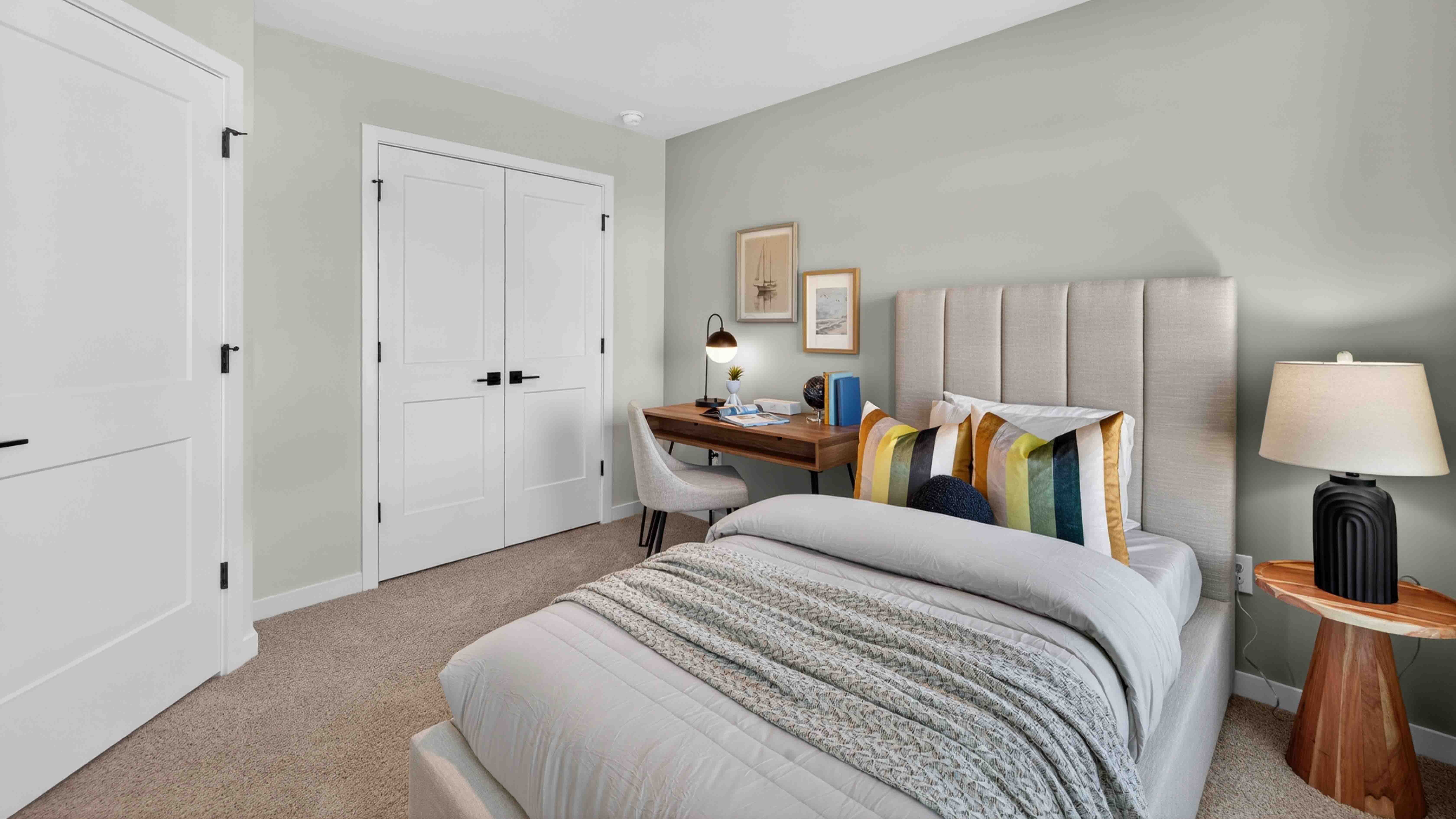 Carpeted bedroom with windows
