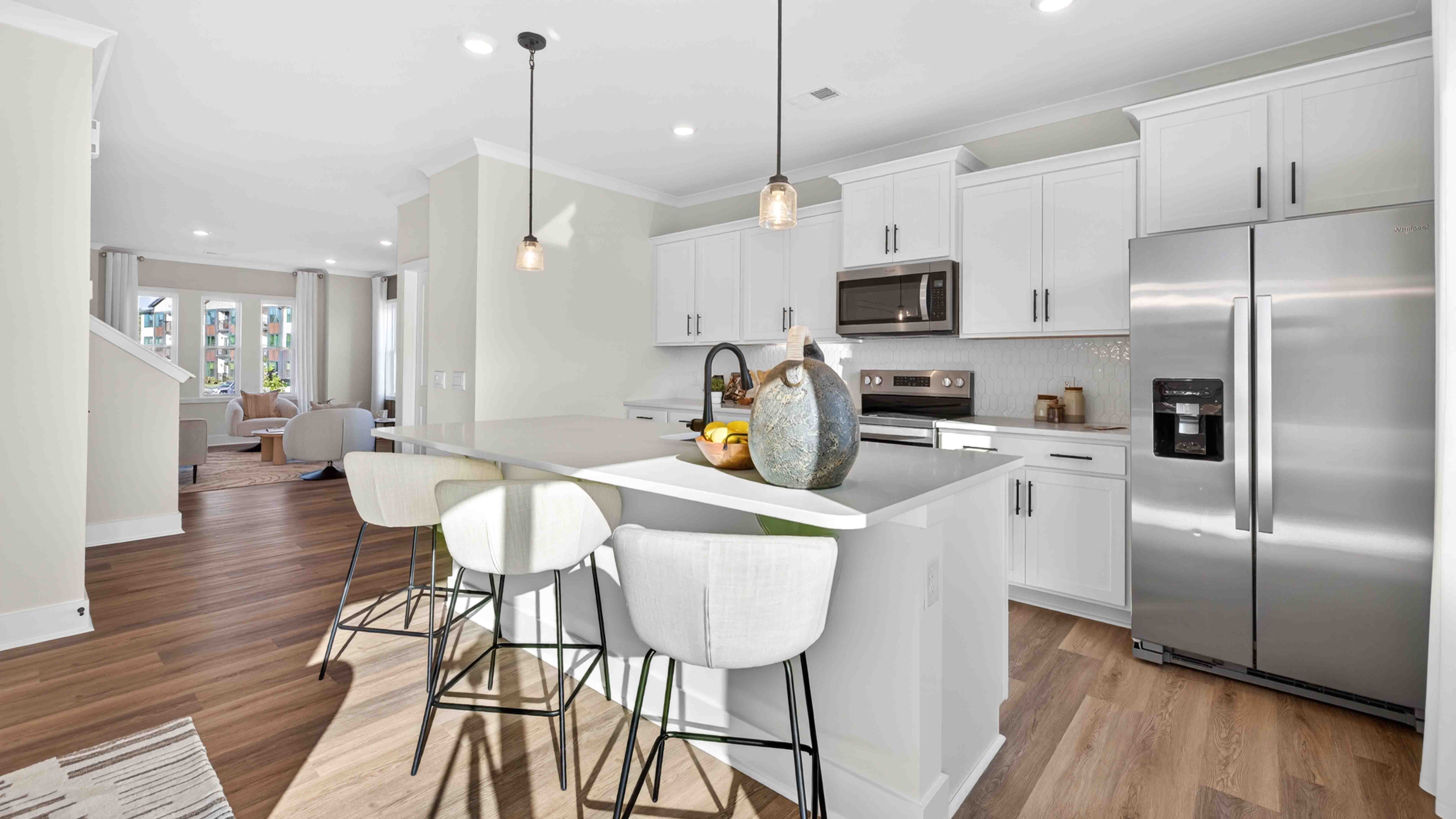 Kitchen and island with stainless steel appliances