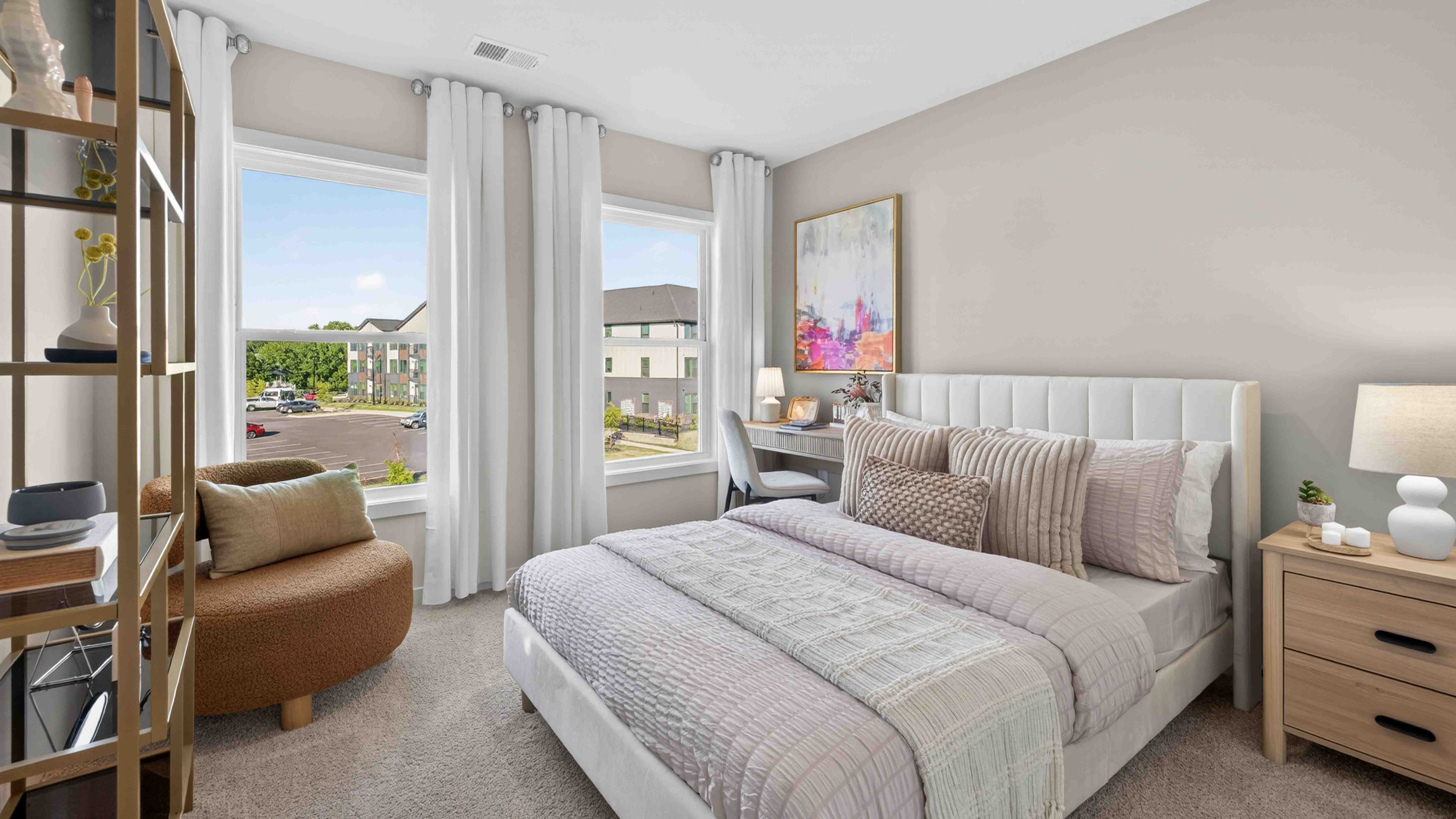 Carpeted bedroom with windows
