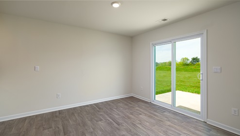 Great room with sliding glass doors, wood floors