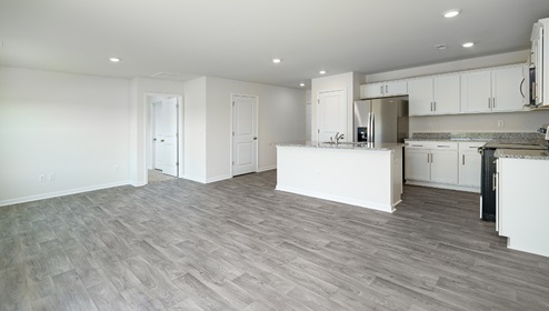 Open kitchen and island with white cabinets