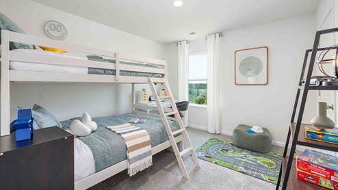 Carpeted bedroom with small window