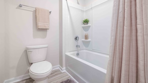 Bathroom with bathtub and shower combination