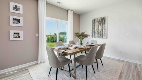 Dining area beside kitchen with sliding glass door to backyard
