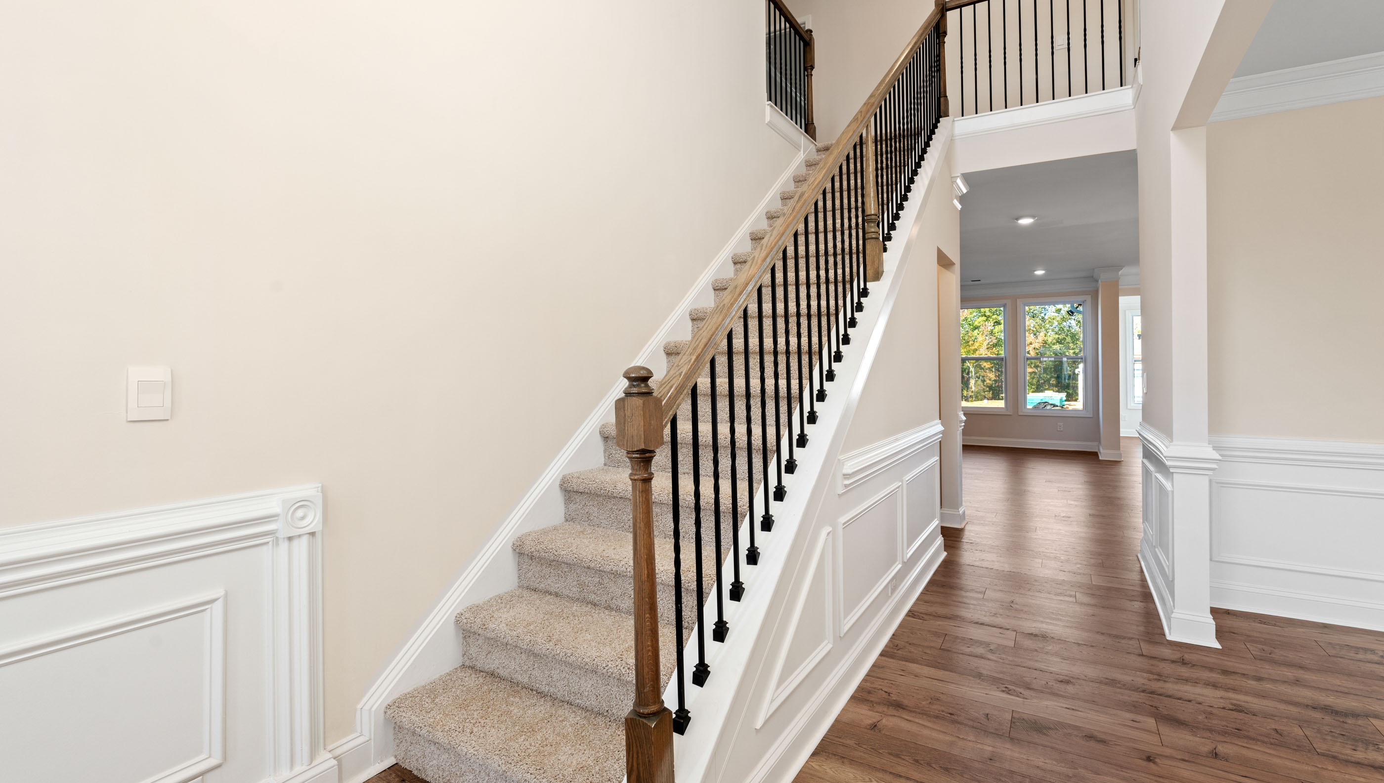 Welcome foyer view of stairs and hallway