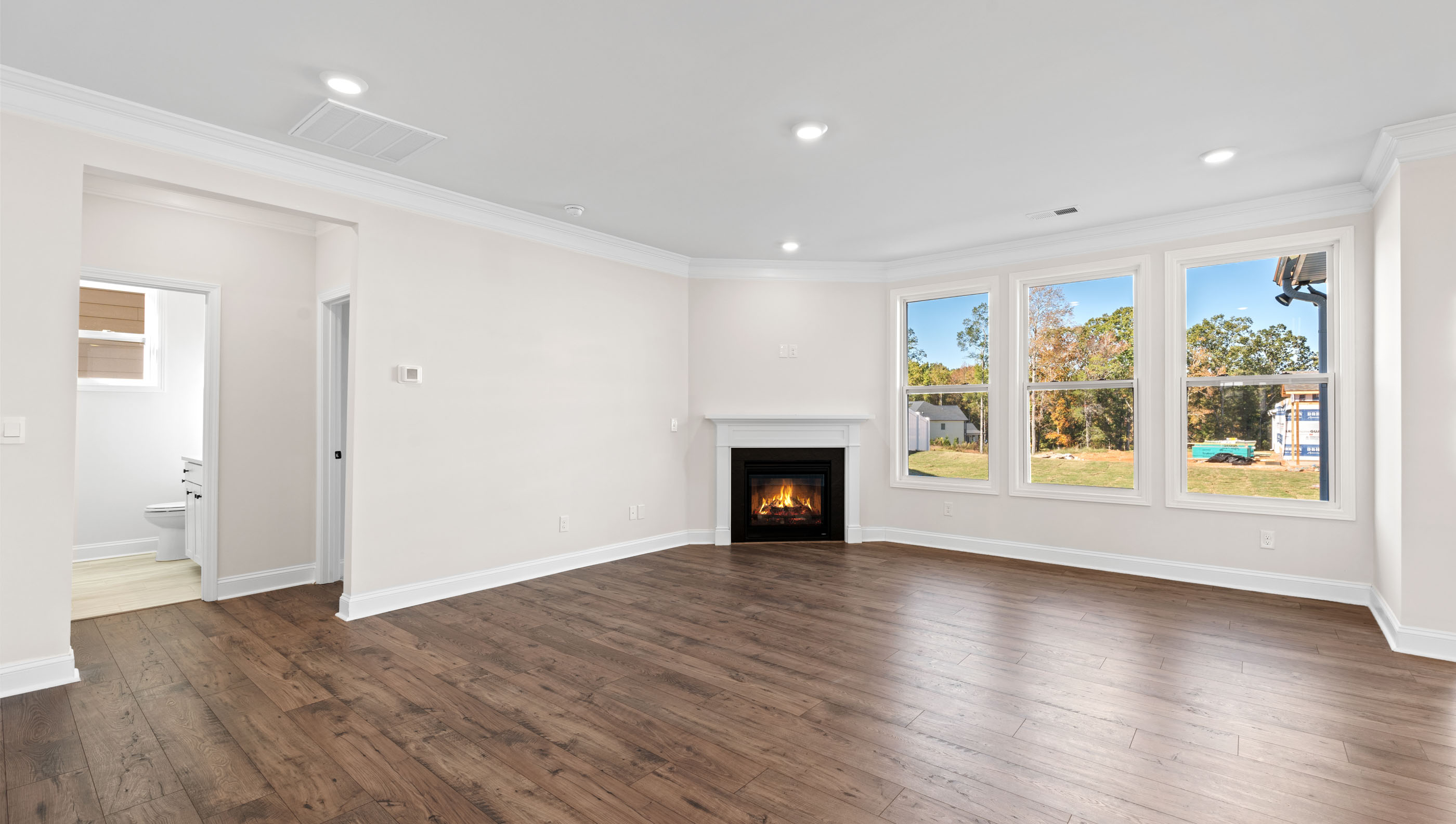 Family room with wood floors and fireplace
