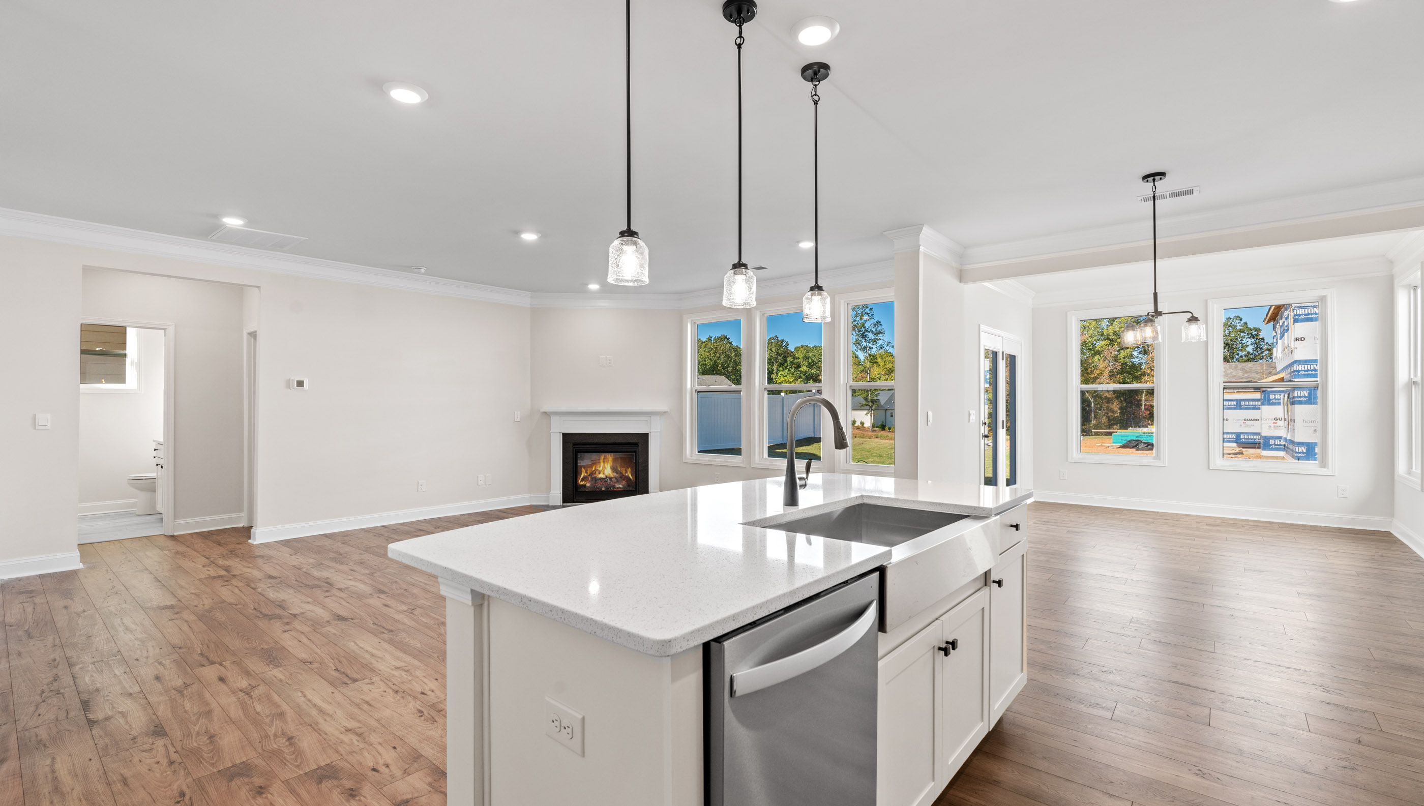 Kitchen and island with white cabinets