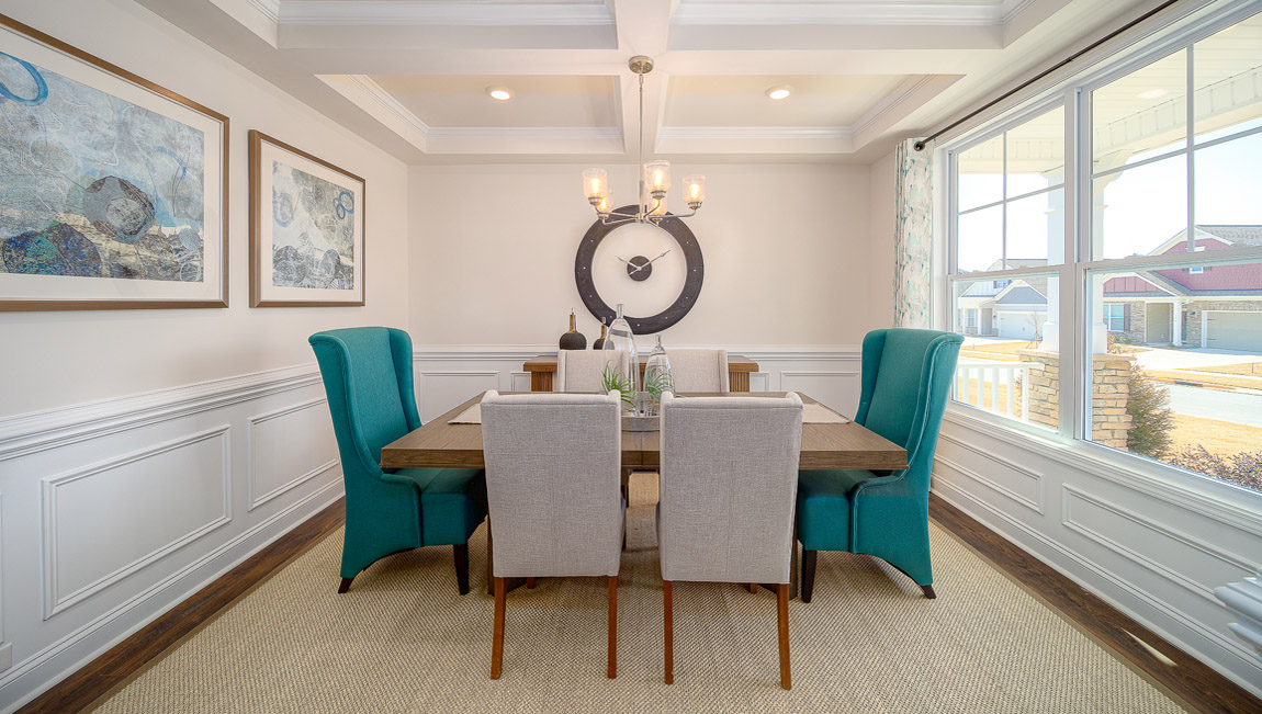Dining room with wood floors, and large window