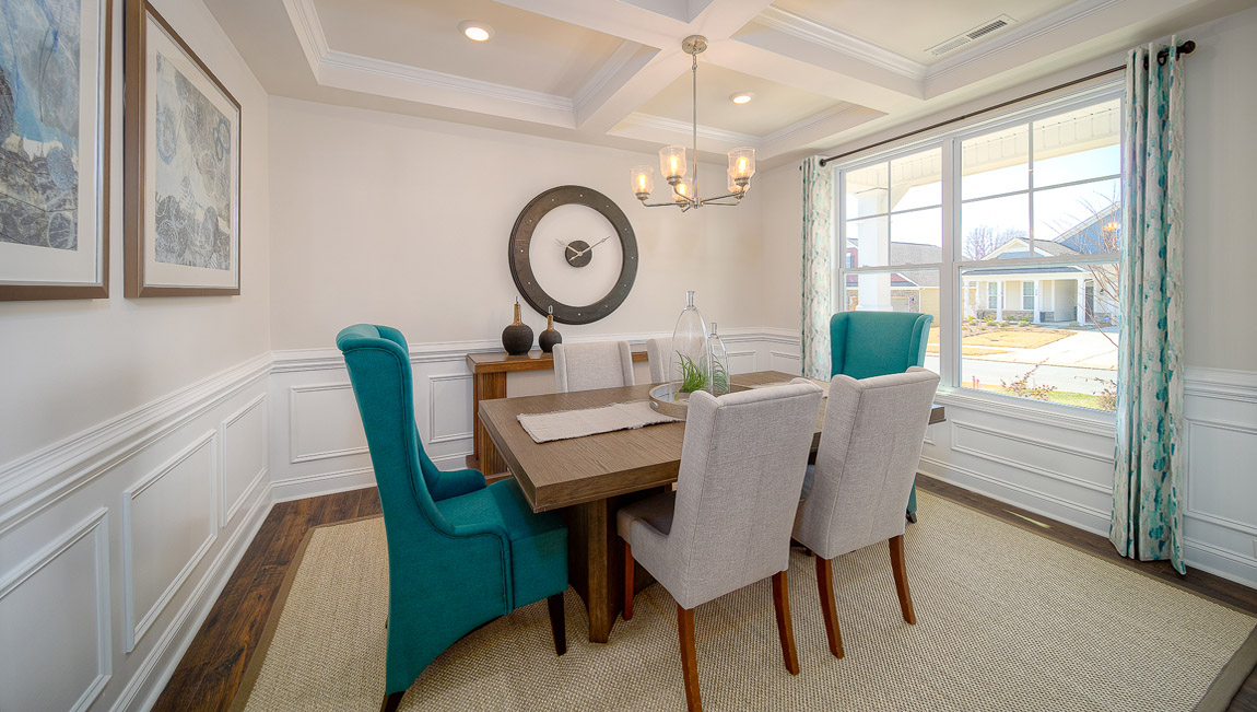 Dining room with wood floors, and large window