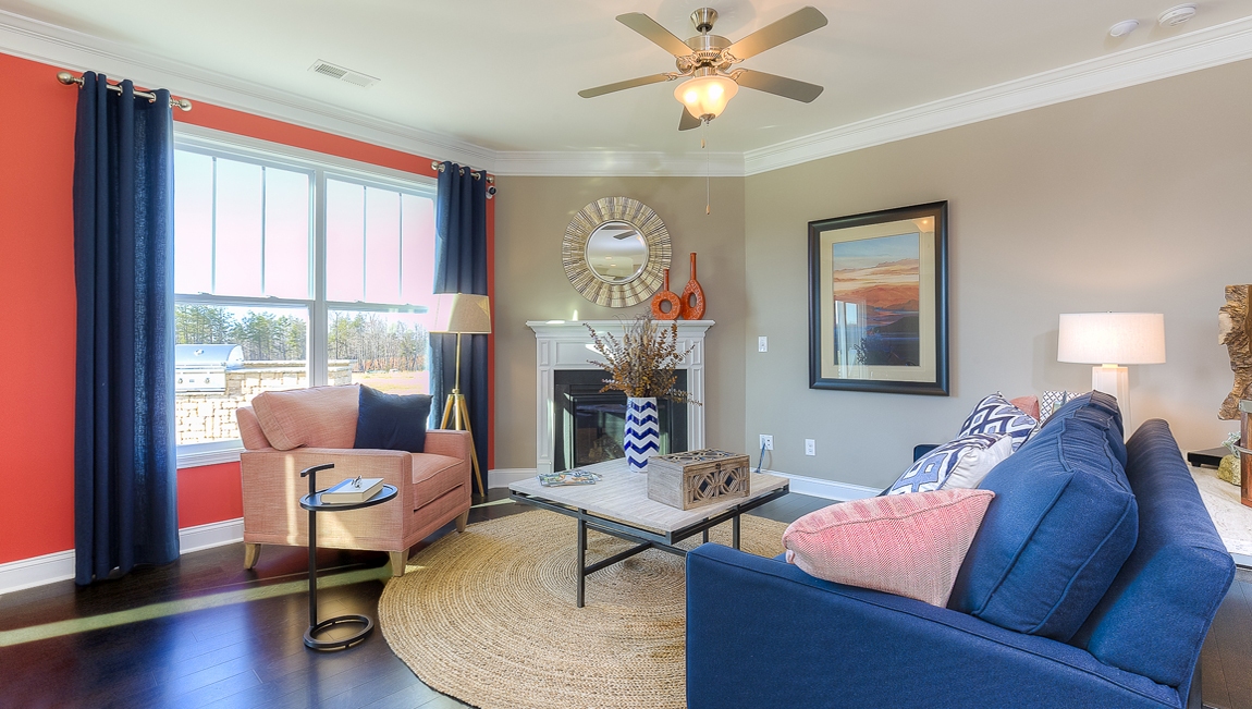 Family room with large window and fireplace