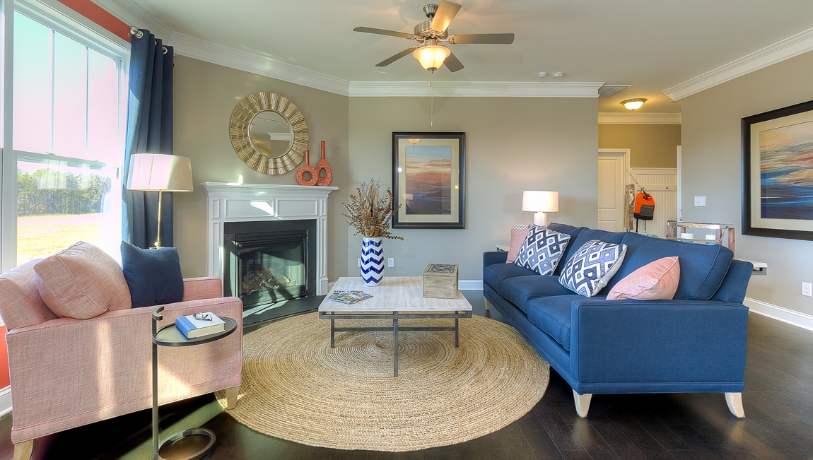 Family room with large window and fireplace
