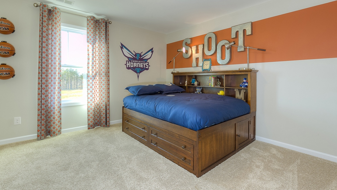 Carpeted bedroom with small window