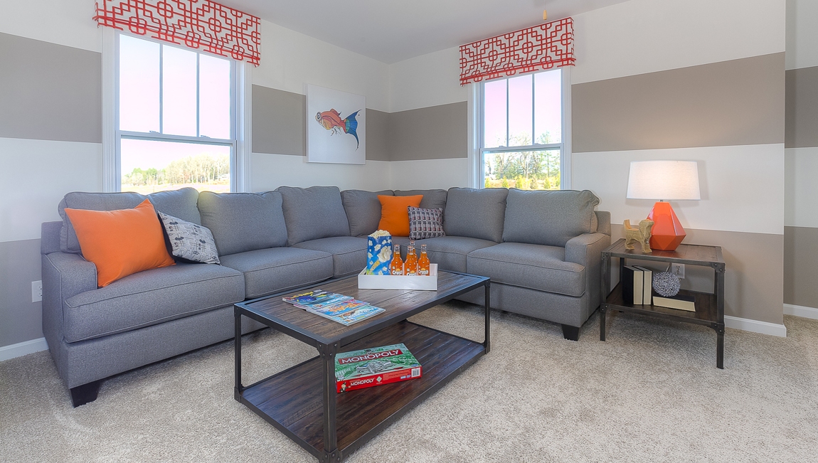 Upstairs Recreational room with carpet and two small windows