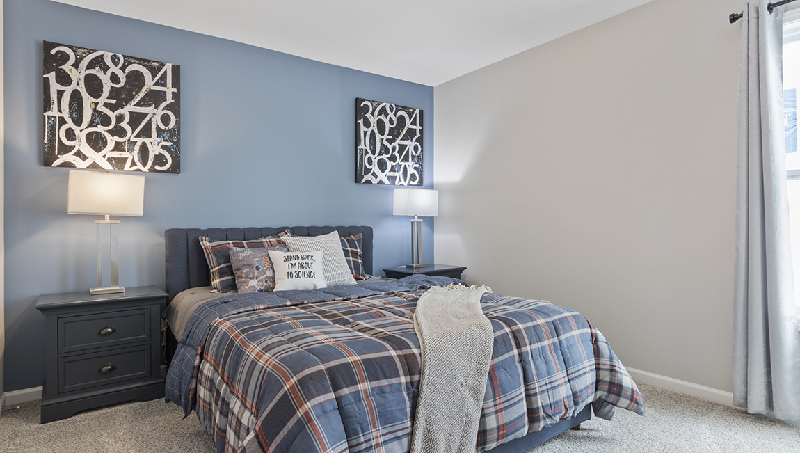 Carpeted bedroom with large window