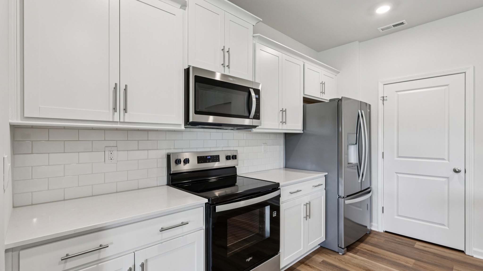 kitchen and island with stainless steel appliances