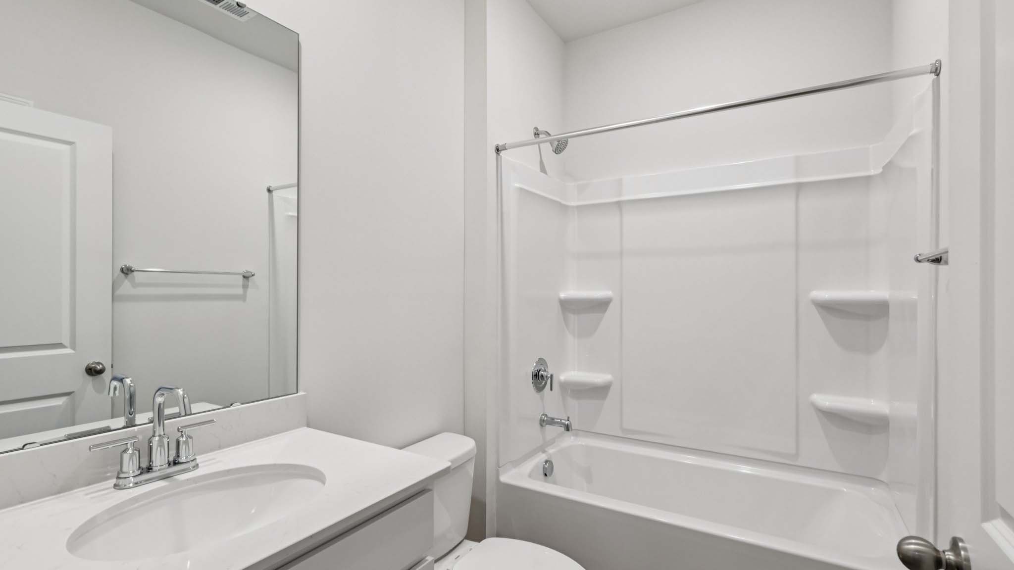 bathroom with bathtub shower combination