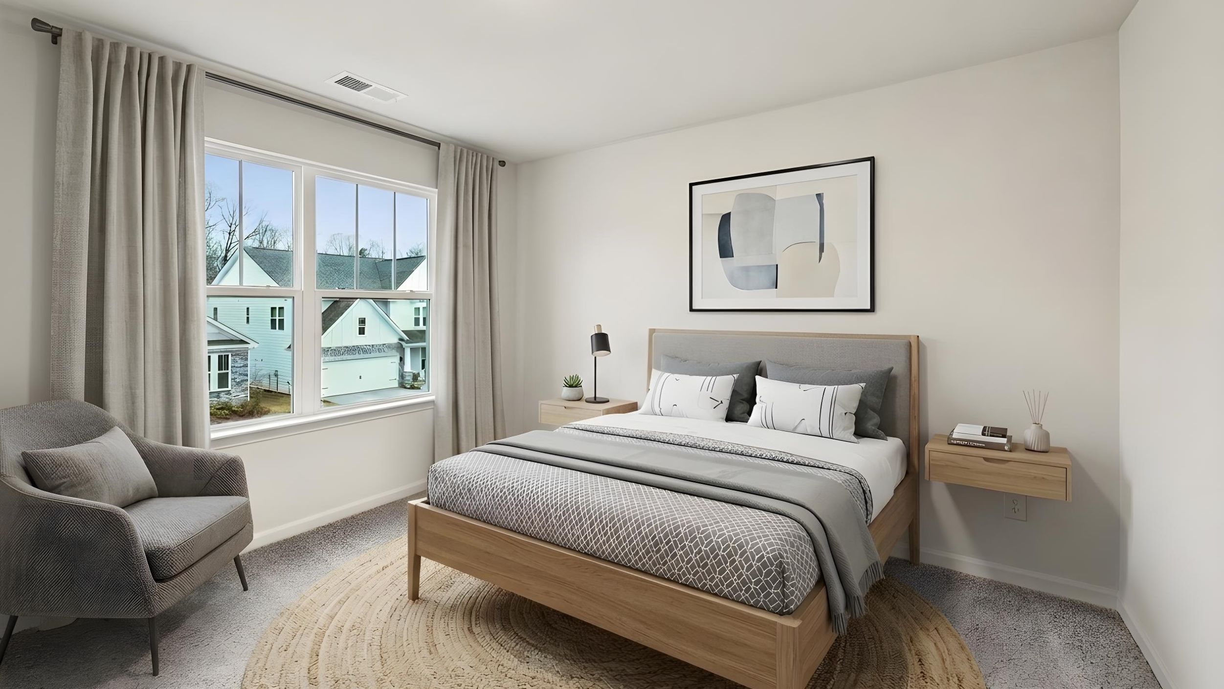 Carpeted bedroom with large window