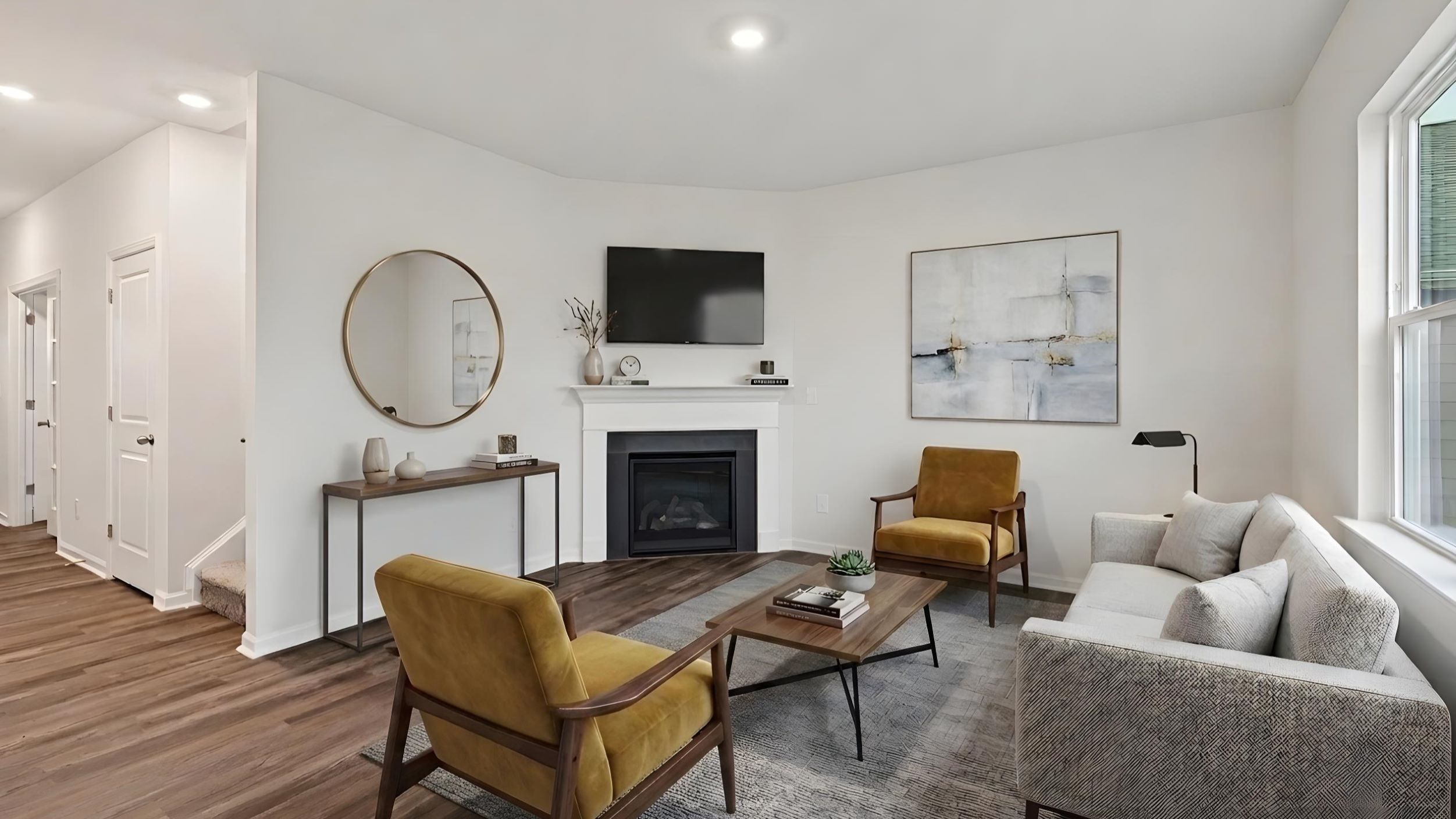 living room with vinyl flooring, electric fireplace and large window