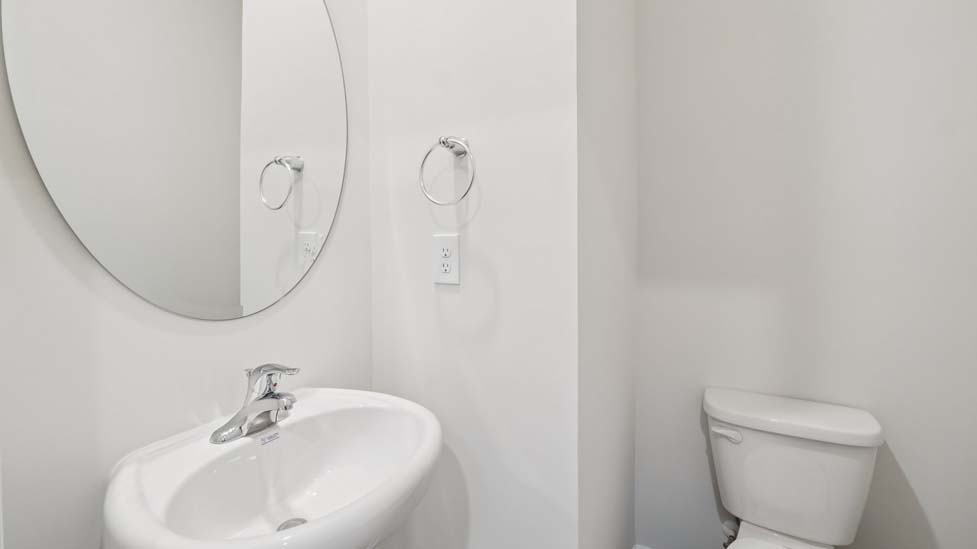 Powder bathroom with toilet and sink