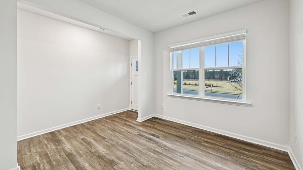 Dining room beside kitchen with sliding glass back door