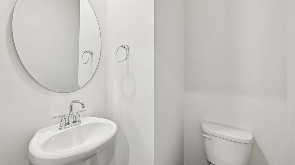 Powder bathroom with toilet and sink